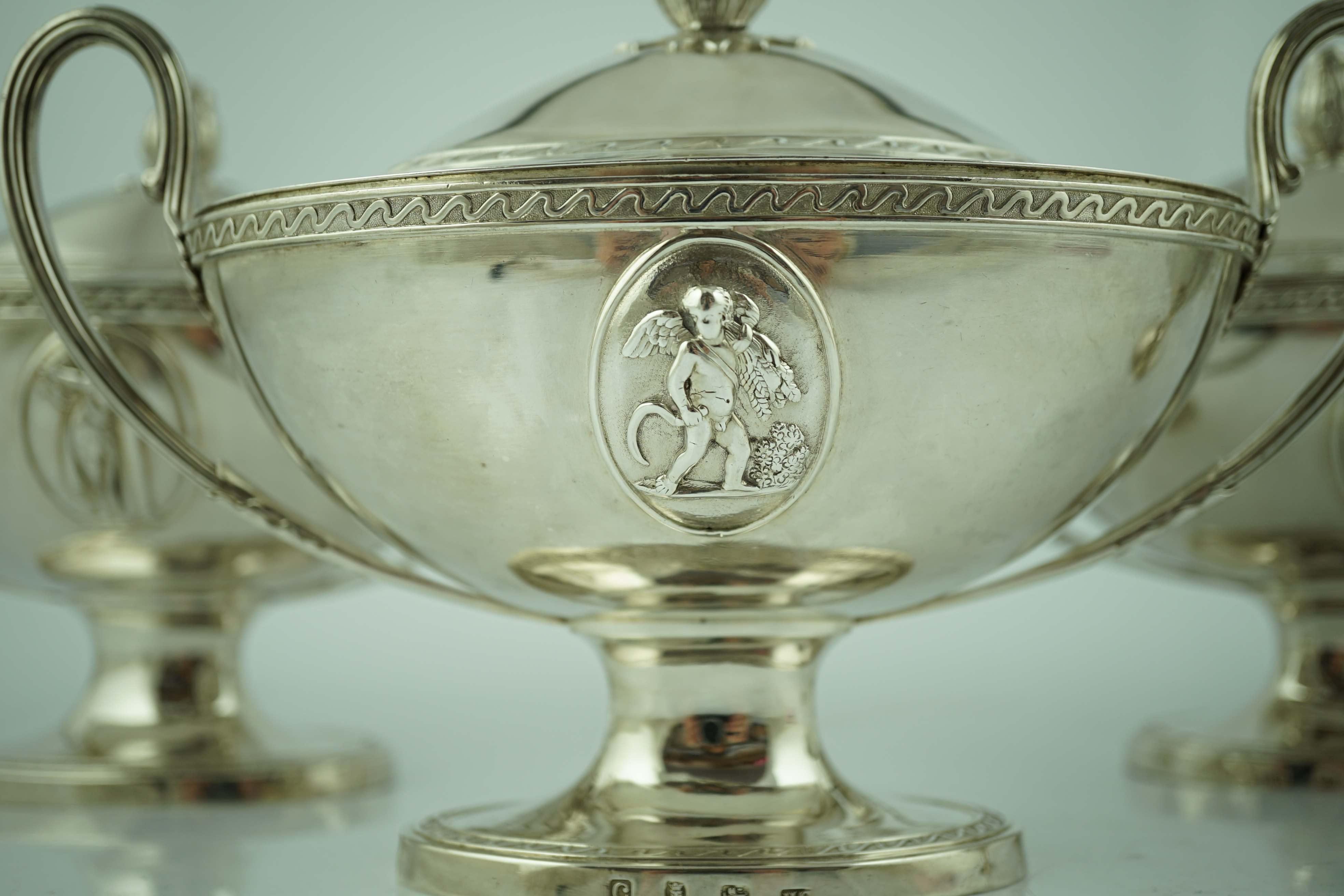 A good set of four George III silver oval pedestal sauce tureen's and covers